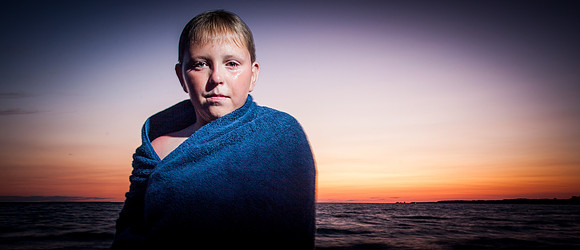 Wet Kid in Towel at Sunset
